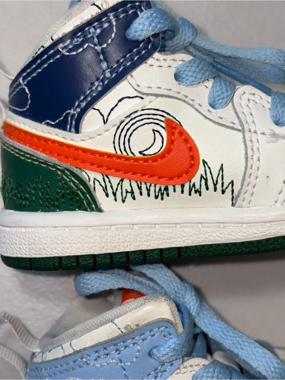 Jordan Kids White, Orange & Green High-Top Sneaker with Light Blue Accents